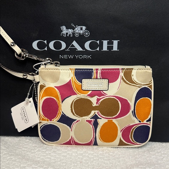 Coach Handbags - Coach Pink, Orange, and Blue Patterned Wristlet